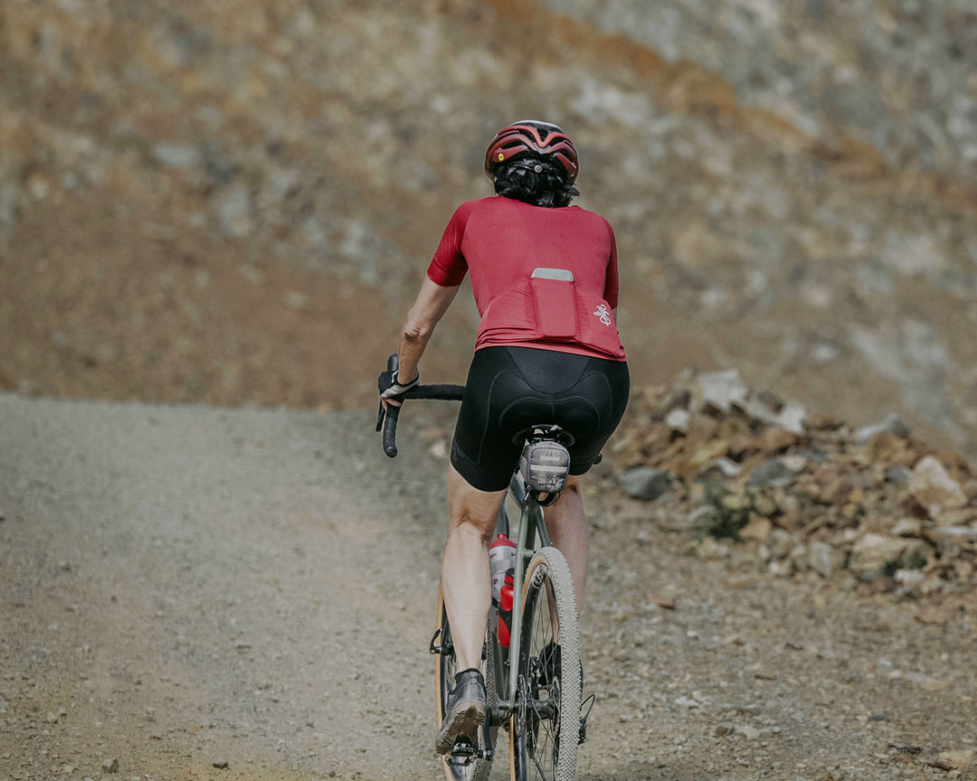 Sigr women's gravel cycling gear on a gravel trail