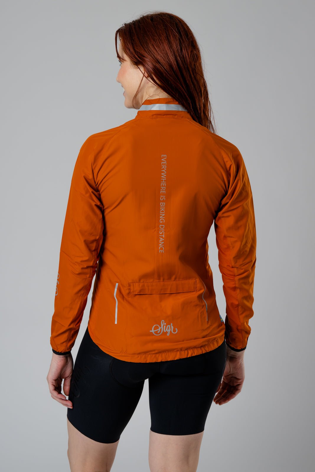 Treriksröset Orange Women's Cycling Wind/Pack Jacket by Sigr Cycling Clothing